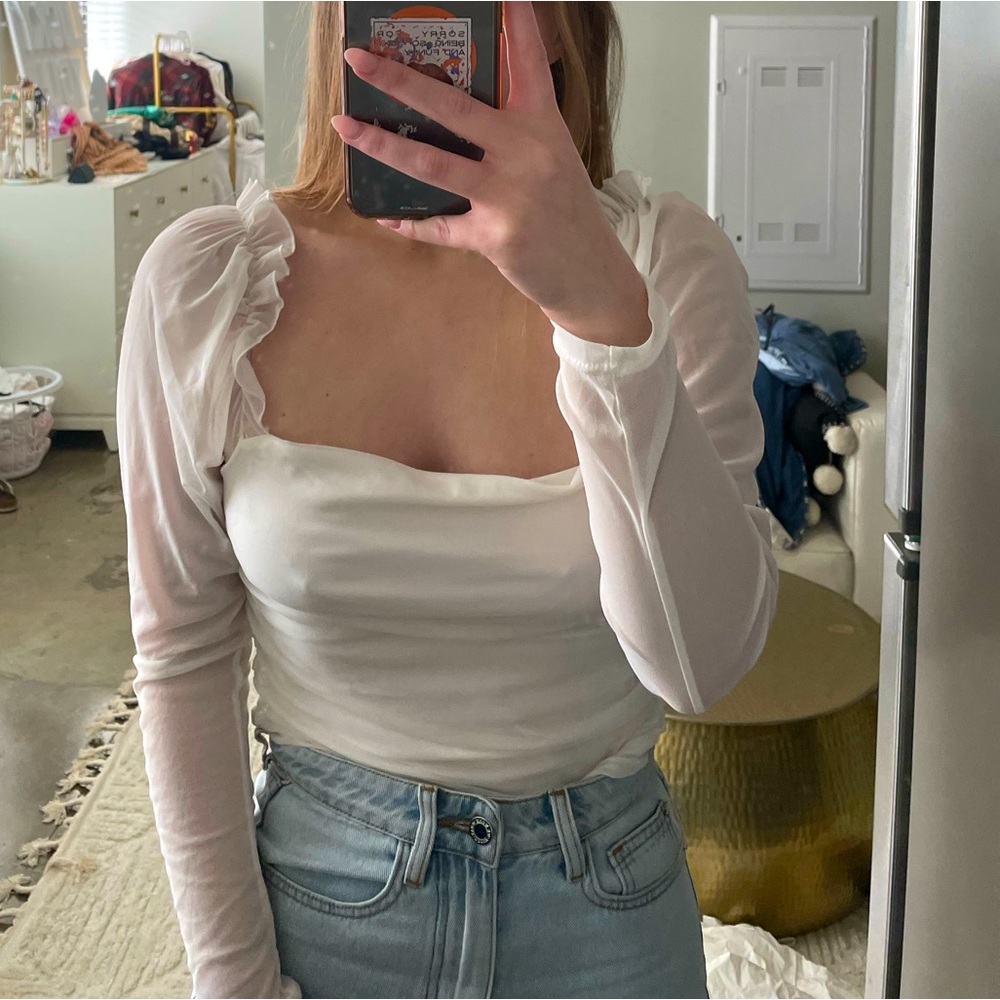 Sheer white long sleeved top